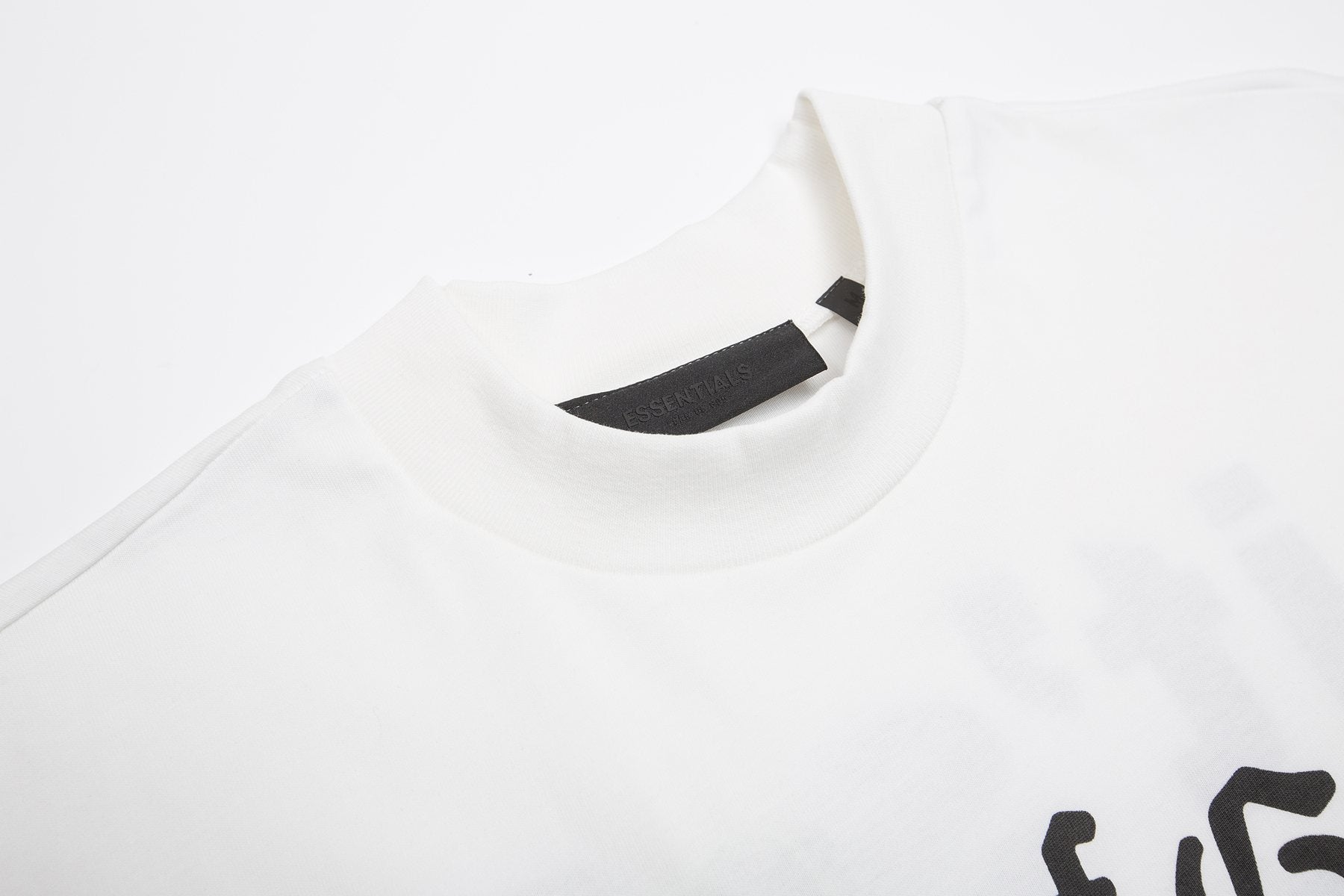 Fear of God Essentials Black College Graphic T-Shirt — neck_label