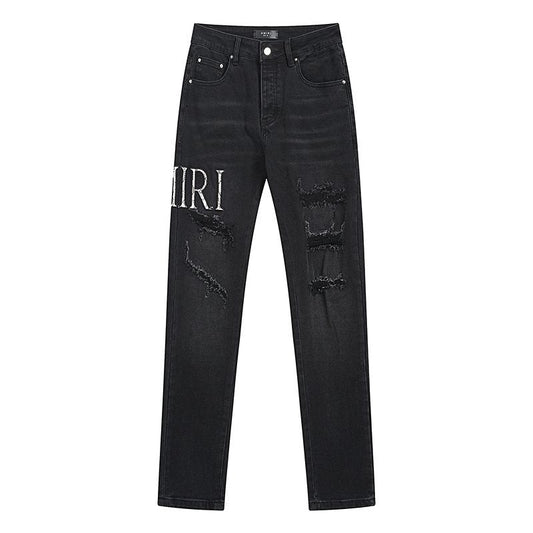 AMIRI Distressed Slim Tapered Jeans — hero
