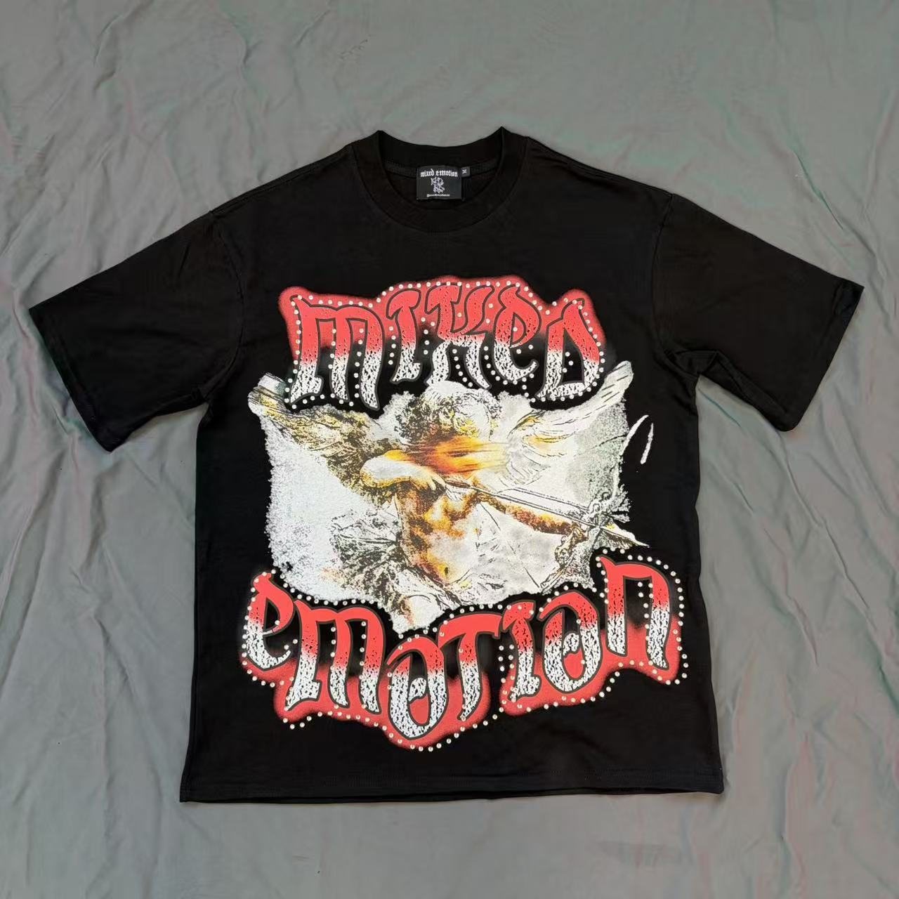 MIXED EMOTION Studded Wing Graphic T-Shirt — front