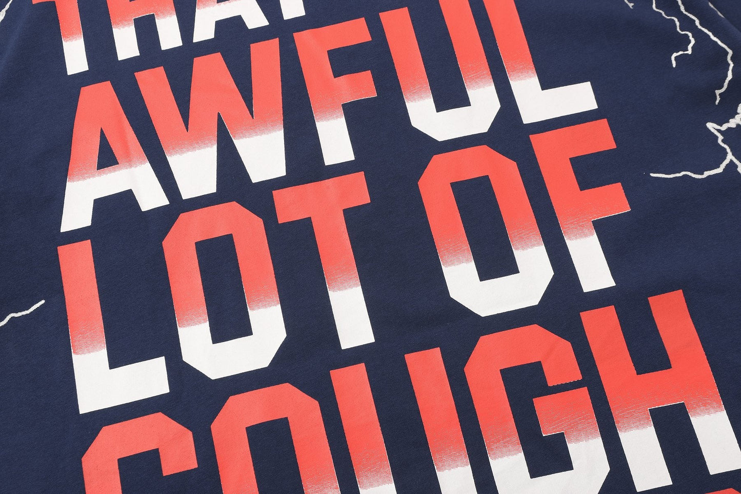 THAT'S A AWFUL LOT OF COUGH SYRUP Lightning Cartoon Graphic T-Shirt — detail