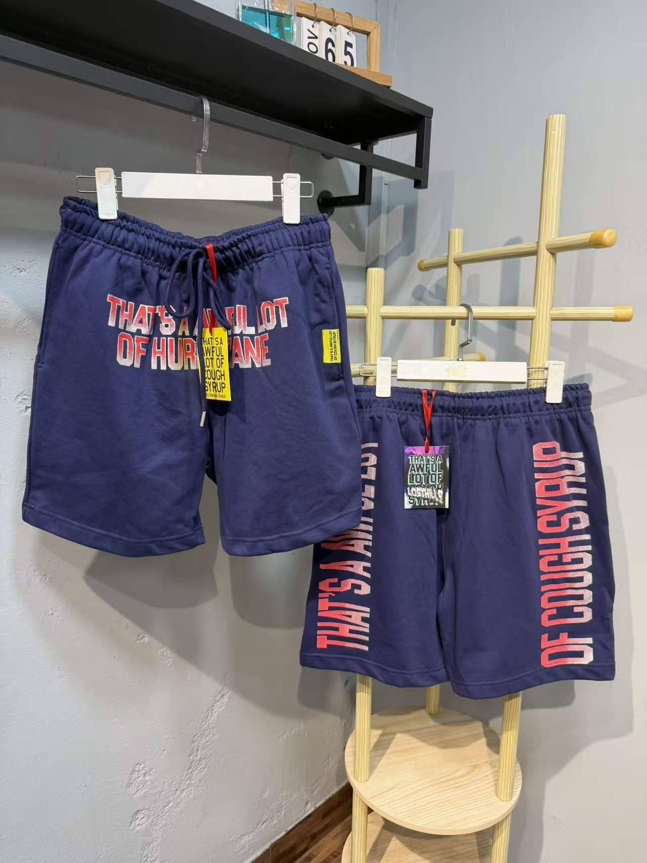 THAT'S A AWFUL LOT OF COUGH SYRUP Blue Text Graphic Shorts — front