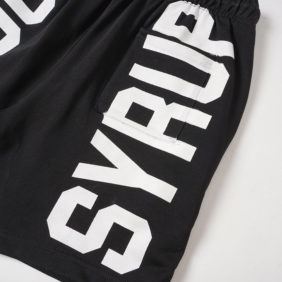 THAT'S A AWFUL LOT OF COUGH SYRUP Black Graphic Shorts — detail