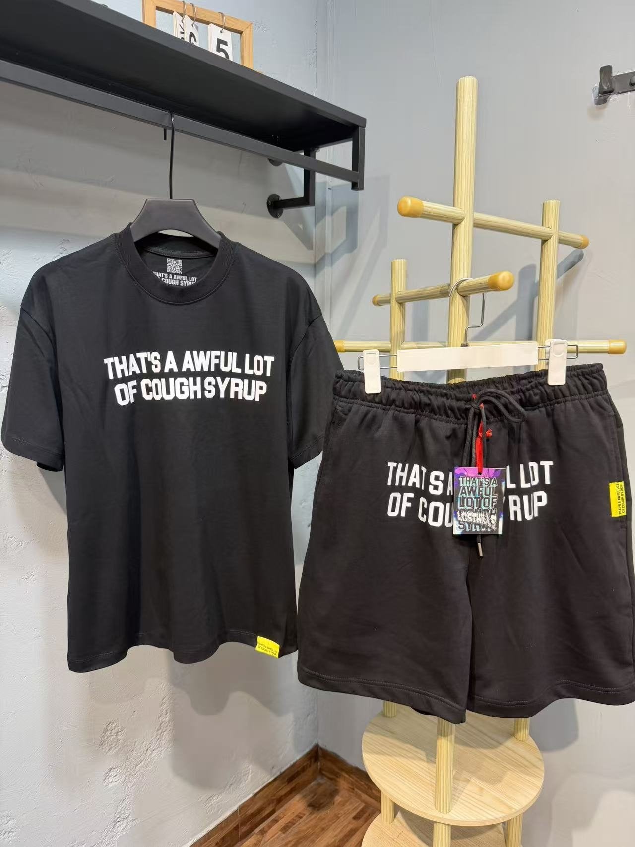 THAT'S A AWFUL LOT OF COUGH SYRUP Bold Wordmark Short-Sleeve Set — front