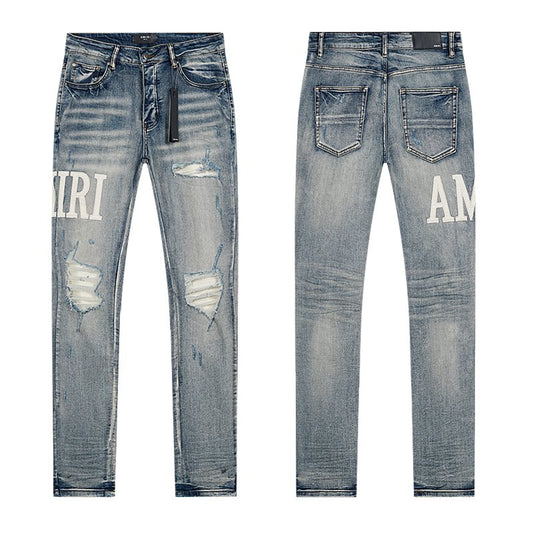 AMIRI Light Blue Distressed Letter Applique Jeans — hero