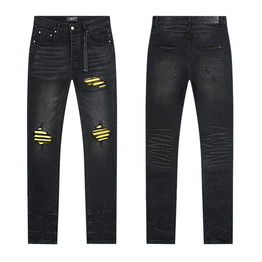 AMIRI Yellow-Backed Distressed Black Jeans — hero