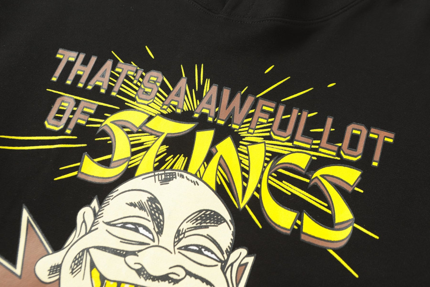 THAT'S A AWFUL LOT OF COUGH SYRUP Stings Character Graphic Hoodie — detail